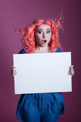 girl with pink hair with White sheet on lilac background, place for text