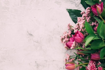 Beautiful tulips over vintage background. Copy space. Top view 