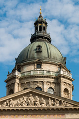 Fototapeta na wymiar Fragment of St. Stephen's Basilica in Budapest, Hungary. Roman catholic church in neoclassical style against the blue sky