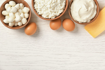 Different dairy products on wooden table