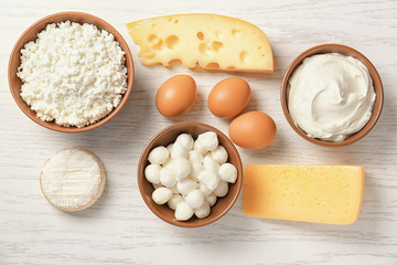Different dairy products on wooden table