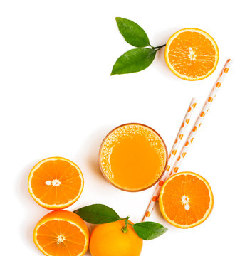 Top view of orange fruits with green leaves and freshly squeezed orange juice  isolated on white background.