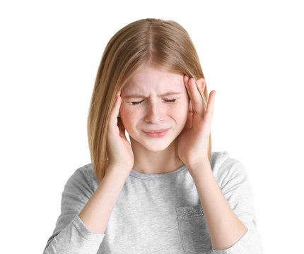 Cute girl suffering from headache on white background