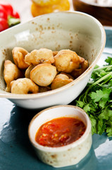 Chuchvara. Fried dumplings with lamb and spicy sauce. Traditional dish of cuisine in Central Asia