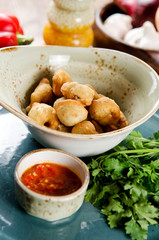 Chuchvara. Fried dumplings with lamb and spicy sauce. Traditional dish of cuisine in Central Asia