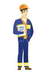 Builder holding clipboard with papers.