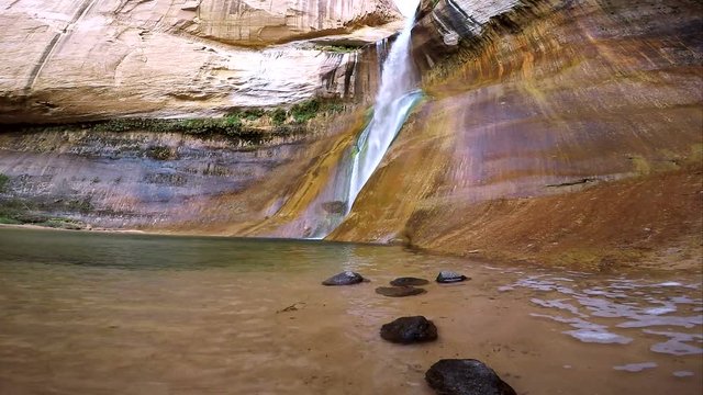 Side view of waterfall flowing, at Lower Calf Creek Falls