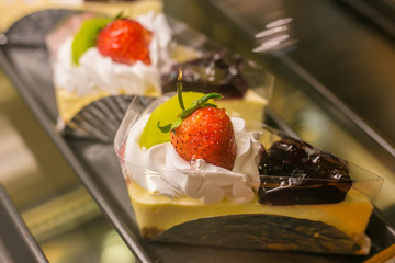 Close up of a part of cake in coffee shop.