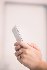 Young woman using smart phone at home