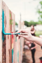 Painting a Colorful Fence