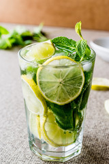 Mojito cocktail with lime, mint leaves and ice.
