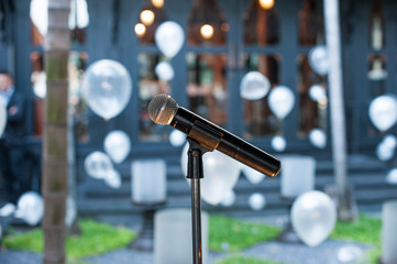 microphone standing and balloons background in the wedding party