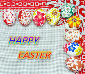 Easter eggs with a pattern of flowers on a tablecloth with hand embroidery