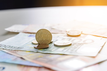 50 Euro cent coin on Euro banknotes