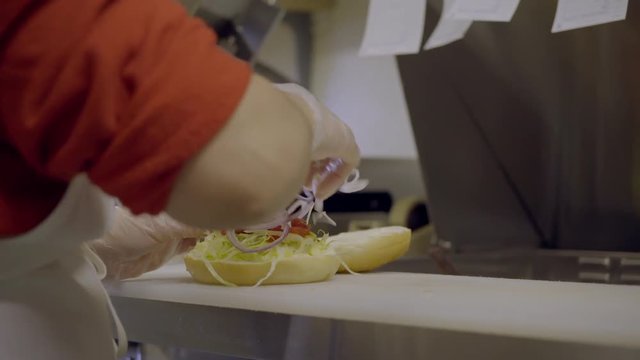 Sub sandwich being made