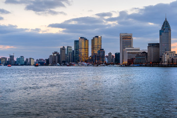 Fototapeta premium River And Modern Buildings Against Sky,reflection of cityscape in river,shot in Shanghai,China.