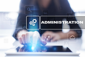 Woman using tablet pc, pressing on virtual screen and selecting administration.