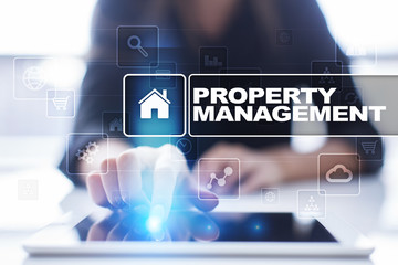 Woman using tablet pc, pressing on virtual screen and selecting property management.