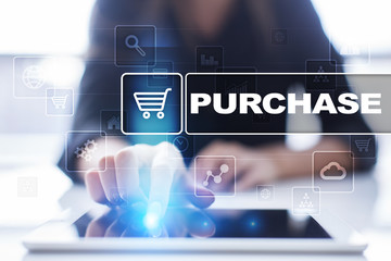 Woman using tablet pc, pressing on virtual screen and selecting purchase.