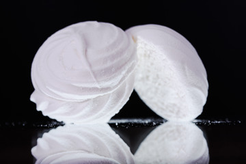 Pieces of marshmallows on a black background