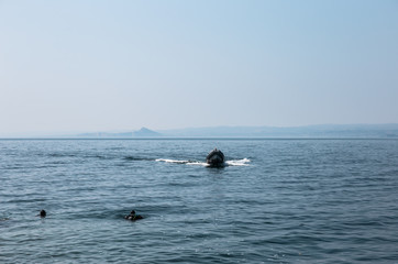 Boat in the lake recovering a scuba diver - Garda Lake (Italy)