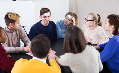 Students playing guess-who game