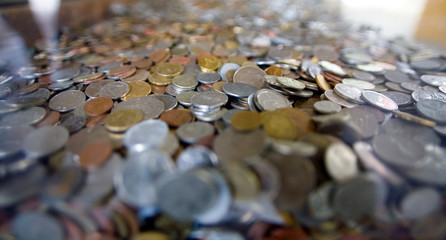 Many coins from different countries of the world.