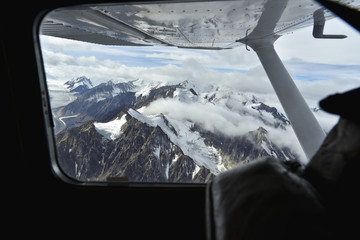 Looking through a window on high mountains in alaska