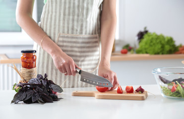 Fresh vegetables on the cutting board, salad in a glass dish. Concept of cooking