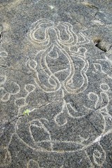 Close-up of a petroglyph, an incision in a rock, which shows Mangai figures which are hooks for fishing in Easter Island, Rapa Nui, Chile, South America