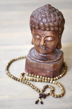 Prayer altar with Buddha statue and Mala for meditation