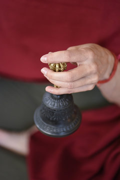 Buddhist prayer bell and meditation posture for a moment of relaxation