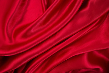 Red cloth waves background texture.