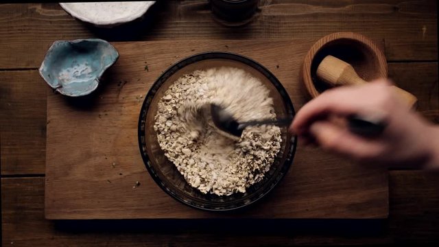 Chef Shuffles Cereals and Spices For Cooking Cutlets