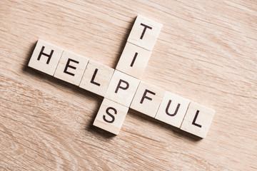Helpful tips concept on business workplace collected of woodens cubes puzzle