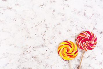Colorful lollipops on white background. Top view
