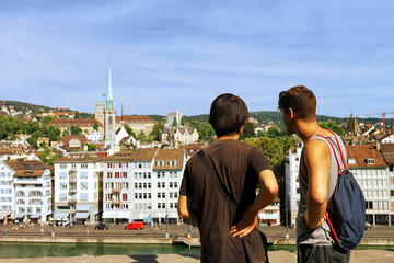 Two young man looking at Limmatquai in Zurich