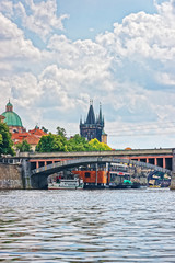 Charles Bridge with Tower over Vltava River in Prague