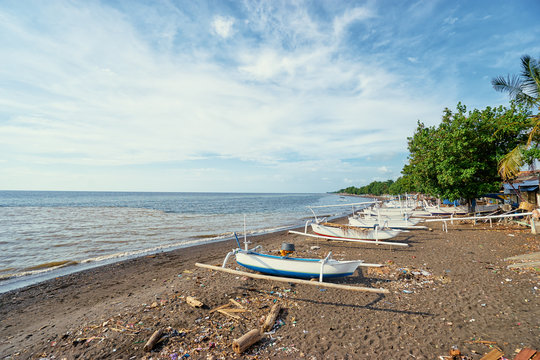 Beautiful landscape. Ocean, beach and indonesian fishing boats.