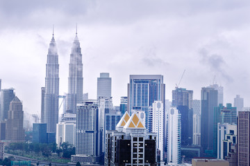 Fototapeta na wymiar Cityscape with cloudy sky and scyscrapers. Megapolis Kuala-Lumpur, Malaysia. 25th of November 2015.