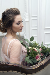 bride's morning. Young girl posing in pink sheer nightie