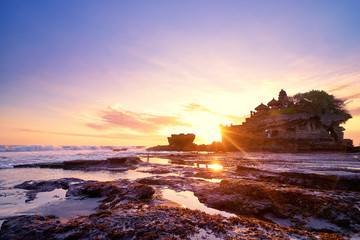 Beautiful balinese landscape. Ancient hinduism temple Tanah lot on the rock against sunset sky. Bali Island, Indonesia. © luengo_ua