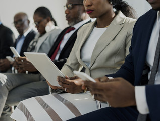 Diverse Business People Use Digital Devices