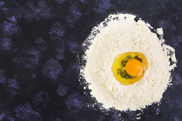 Dough for baking or pastry on dark background. Top view