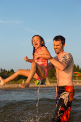 Obraz premium Mixed race family at the beach