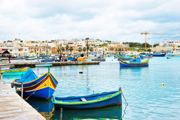 Obraz premium Luzzu colorful boats at Marsaxlokk Harbor at Malta