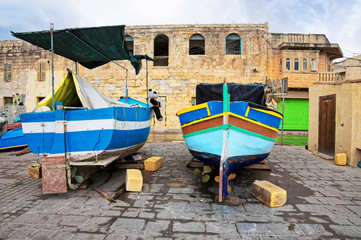 Fototapeta na wymiar Luzzu colorful boats at Marsaxlokk Malta