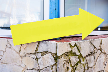 Yellow plastic informational sign arrow. Show the direction. Blank Sign post. Abstract yellow arrow...