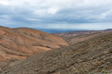 Fototapeta na wymiar Spain, Canary Islands, Fuerteventura. Arid mountain landscape