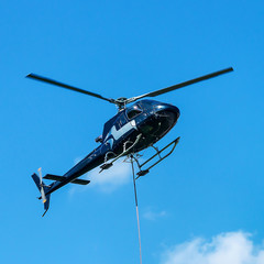 Fototapeta na wymiar Helicopter flying in sky at Lavaux Switzerland